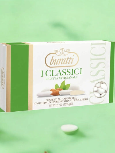 Scatola di confetti alla mandorla Buratti su sfondo verde, dolci italiani classici.